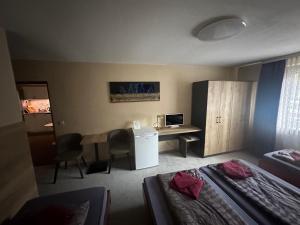 Postel nebo postele na pokoji v ubytování Hotel Pension Pamina