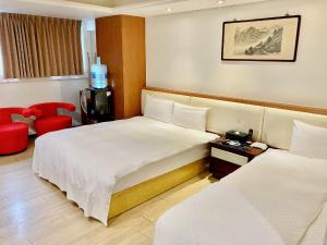 Letto o letti in una camera di Tianmu Star Urban Living