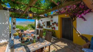 a table with food on it in a house at Casa Belmonte Alcaucín by Ruralidays in Alcaucín
