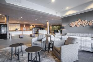 a lobby with couches and tables in a store at Hotel Levi Panorama in Levi