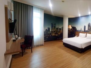 Postel nebo postele na pokoji v ubytování GiiA Sanno Hotel Pluit