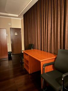an office with a desk and chairs in a room at Your Home (YH) in Yerevan