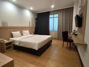 Postel nebo postele na pokoji v ubytování GiiA Sanno Hotel Pluit