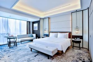 Postel nebo postele na pokoji v ubytování 银都酒店 Yandoo Hotel