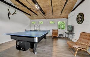 a pool table in a room with a ping pong ball at Nice Home In Ebeltoft With 4 Bedrooms in Ebeltoft