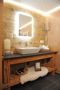 a bathroom with a sink and a mirror at Apart Oetz in Oetz