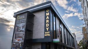 a building with a sign for a sun hotel at Mardy Suit Hotel in Istanbul