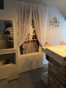 Postel nebo postele na pokoji v ubytování Godot Apartman