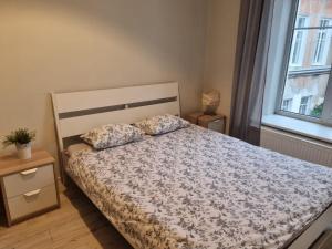 Cama ou camas em um quarto em Igo apartment Uzupis