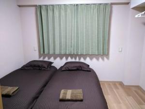 Кровать или кровати в номере Hitoyado Ryokan Higashiueno - Vacation STAY 35819v