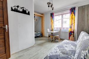 Posteľ alebo postele v izbe v ubytovaní Willa pod Zegarem - w cenie Parking, szybkie Wifi, duzy ogrod, wiata grilowa!