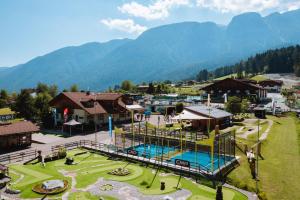 an aerial view of a resort with mountains in the background at Camping Dolomiti in Dimaro