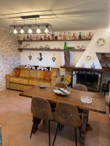 a living room with a wooden table and chairs at Casa Vacanza Pescocostanzo in Pescocostanzo
