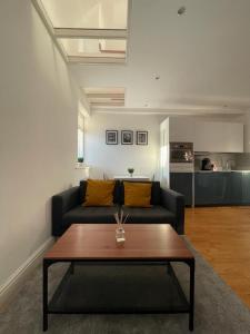 a living room with a couch and a coffee table at Gateforth Flat-Lovely 1 Bed in the heart of Central London in London