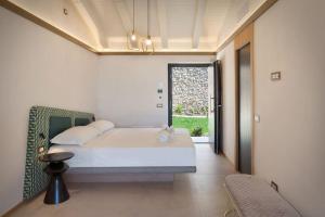 Voodi või voodid majutusasutuse Villa Divina22-APT Armonia-Con Piscina e vista lago toas