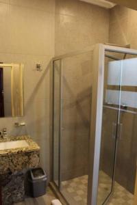 a bathroom with a shower and a sink at A pristine BB located in the peaceful suburb of Belvedere Harare - 2008 in Harare