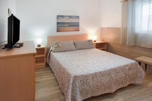 Posteľ alebo postele v izbe v ubytovaní El Faro Sardina