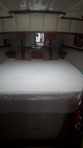 a large white bed in a small room at Blacky in Bodrum City