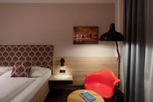 Posteľ alebo postele v izbe v ubytovaní Altstadthotel Kasererbräu