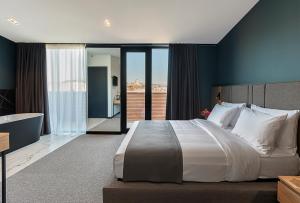 Katil atau katil-katil dalam bilik di Graf Hotel