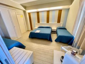 Ένα ή περισσότερα κρεβάτια σε δωμάτιο στο Hotel Al Rustico