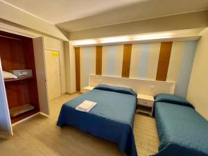 Ένα ή περισσότερα κρεβάτια σε δωμάτιο στο Hotel Al Rustico