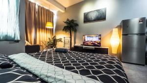 Montana Suites, Empire Damansara tesisinde bir odada yatak veya yataklar