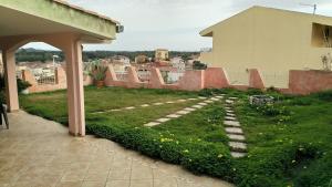 a garden on the roof of a house at Appartamento Panorama in Muravera