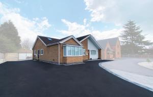 a house with a driveway in front of it at Oak Tree Annex Keppel Gate B & B in Overseal