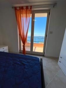 A bed or beds in a room at NaturAmare Apartments Palinuro