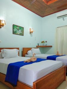 Ένα ή περισσότερα κρεβάτια σε δωμάτιο στο gery watukarung surfcamp