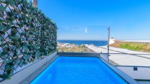 a swimming pool on the balcony of a house at Torre Vigía Torrox by Ruralidays in Torrox
