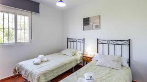 A bed or beds in a room at Chalet Algar by Ruralidays