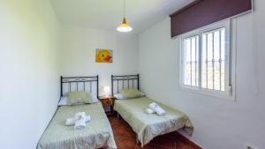 A bed or beds in a room at Chalet Algar by Ruralidays Még 16 kép