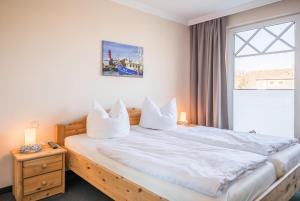 Postel nebo postele na pokoji v ubytování "Appartementhaus Meeresbucht" Appartementhaus Meeresbucht Whg 6