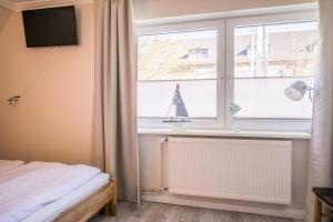 Postel nebo postele na pokoji v ubytování "Appartementhaus Meeresbucht" Appartementhaus Meeresbucht Whg 6