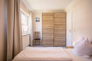 Postel nebo postele na pokoji v ubytování "Appartementhaus Meeresbucht" Appartementhaus Meeresbucht Whg 6