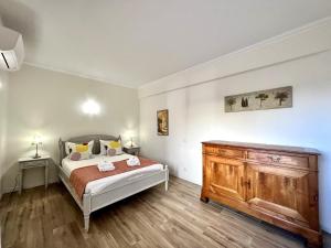 Ένα ή περισσότερα κρεβάτια σε δωμάτιο στο Albufeira Central 4 by Homing