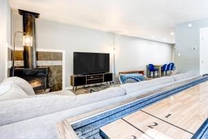 a living room with a large couch and a pool at Incline Village Getaway in Incline Village