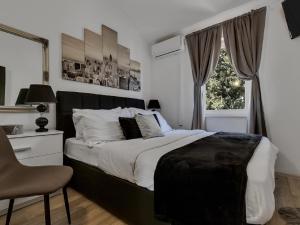 Postel nebo postele na pokoji v ubytování Apartman Rita