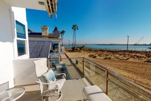 a balcony of a house with a view of the beach at Sunshine Beach Escape in Seal Beach