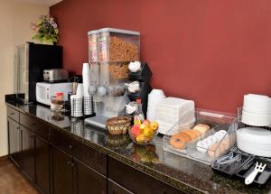 a kitchen with a counter with food on it at Red Roof Inn Cartersville-Emerson-LakePoint North in Cartersville