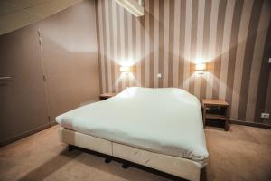 Postel nebo postele na pokoji v ubytování Hotel Louisa