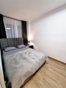 Postel nebo postele na pokoji v ubytování SunMarine Hel