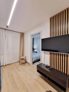 TV a/nebo společenská místnost v ubytování SunMarine Hel