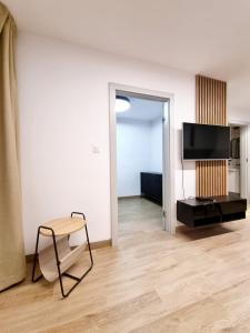 TV a/nebo společenská místnost v ubytování SunMarine Hel