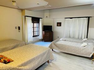 Säng eller sängar i ett rum på SWEET HOME PATAGONIA