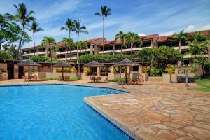 a swimming pool in front of a hotel at Kaanapali Royal B201 in Lahaina