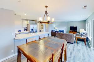 a kitchen and living room with a table and a dining room at Park Pointe Mutual in Chelan