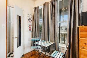 a room with a table and chairs and a window at Lucky Number #13 in Tybee Island